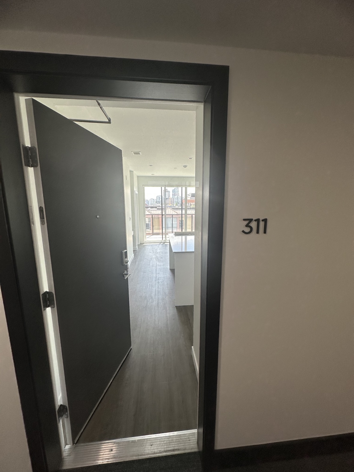 Freshly painted apartment interior seen from the entry door in Victoria, BC
