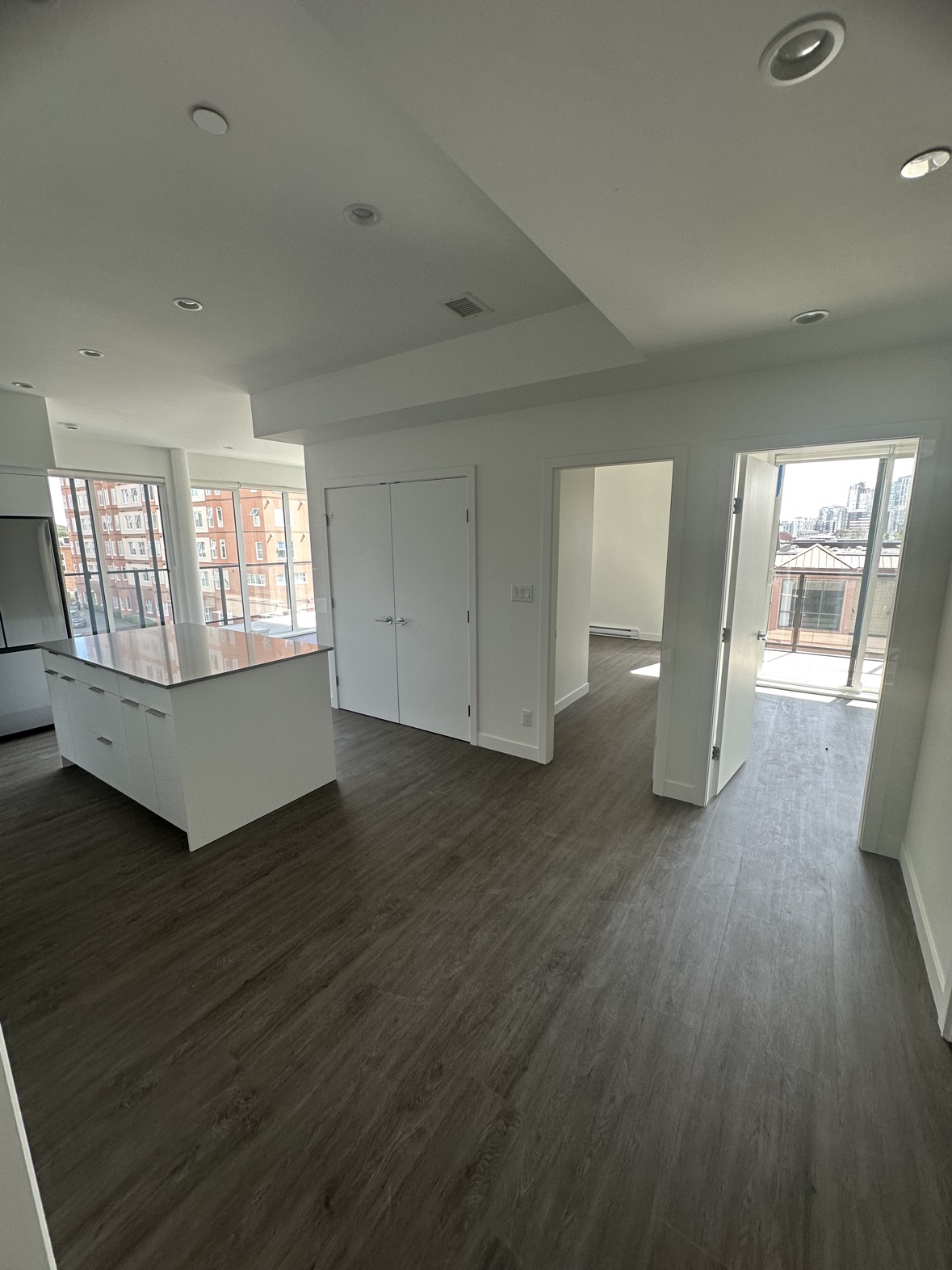 Condo living room painting with floor-to-ceiling windows in Victoria, BC