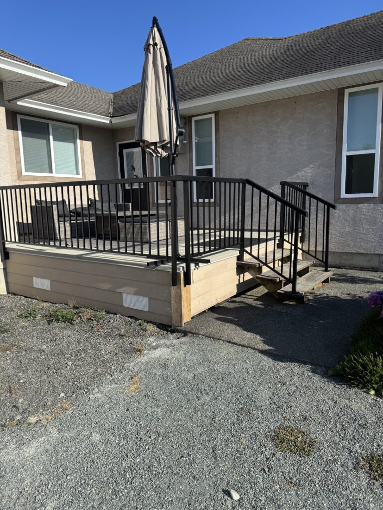 Deck painting black railing stairs victoria by Rebirth Painting Ltd. in Victoria, BC