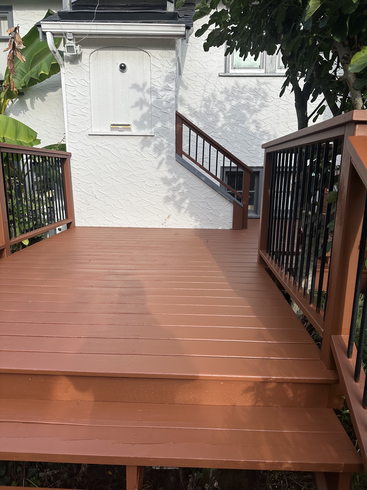 Deck painting with stairs and railings in Victoria, BC