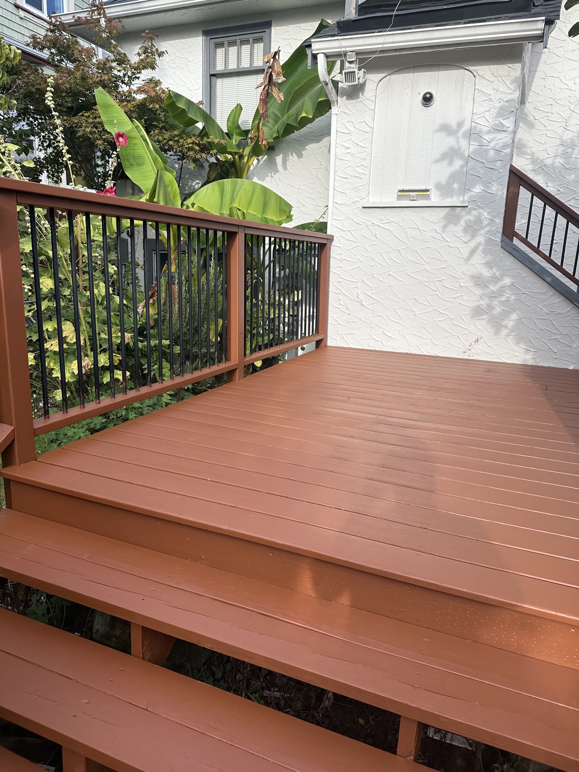 Deck staining finished in terracotta by Rebirth Painting in Victoria, BC