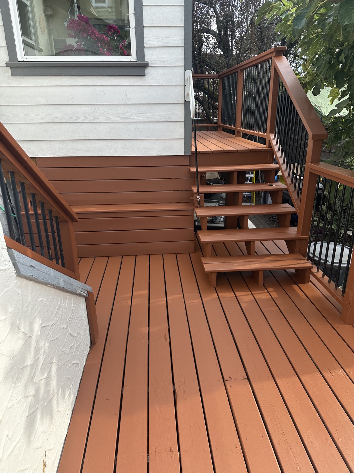 Deck staining in a warm terracotta finish in Victoria, BC