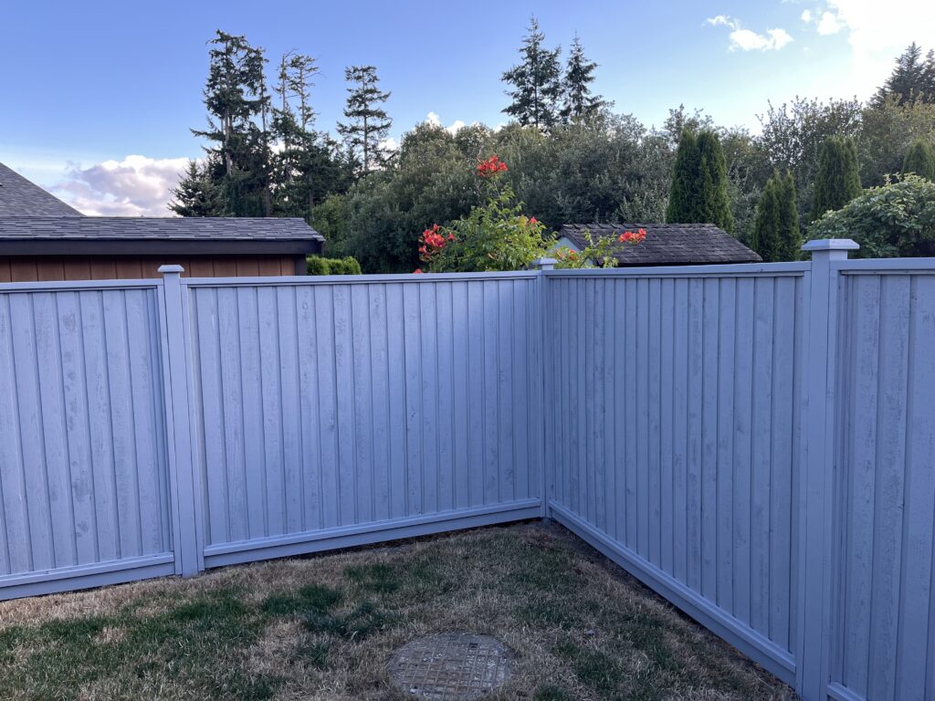 Fence painting blue wooden fence victoria by Rebirth Painting Ltd. in Victoria, BC