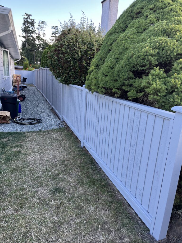 Fence painting white wooden fence victoria by Rebirth Painting Ltd. in Victoria, BC