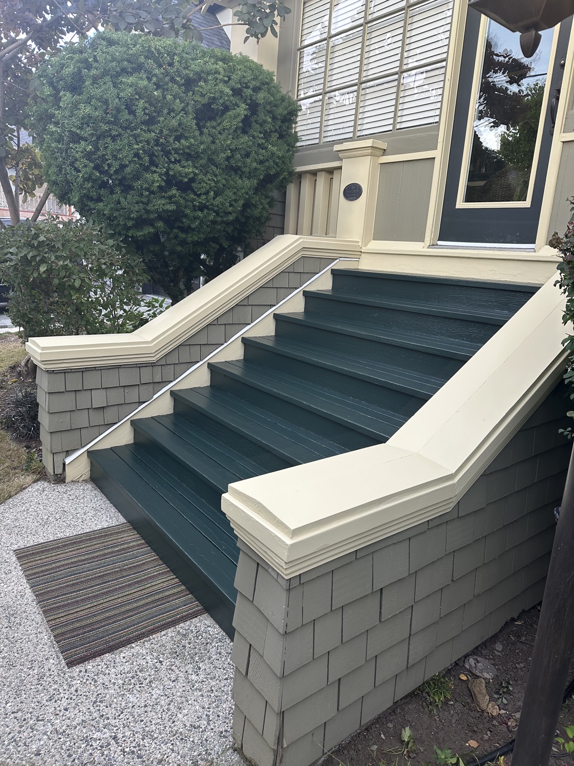 Front porch steps and shingle siding painted by Rebirth Painting in Victoria, BC