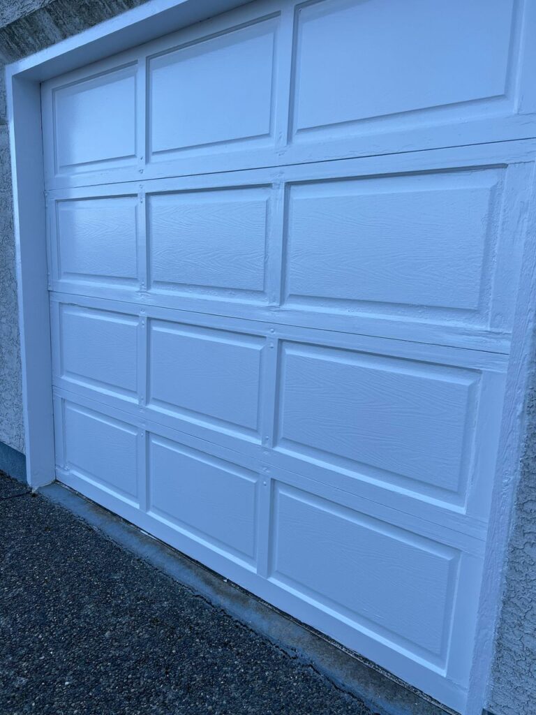Garage door painting white panel victoria bc by Rebirth Painting Ltd. in Victoria, BC