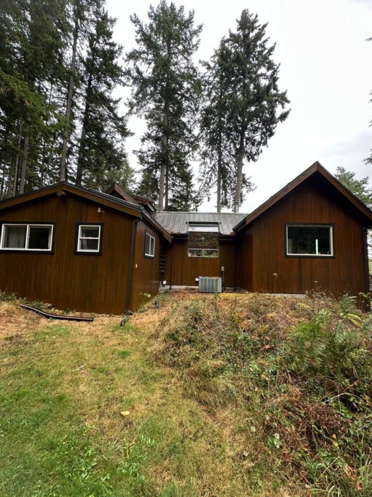 House exterior painting brown siding white windows victoria by Rebirth Painting Ltd. in Victoria, BC