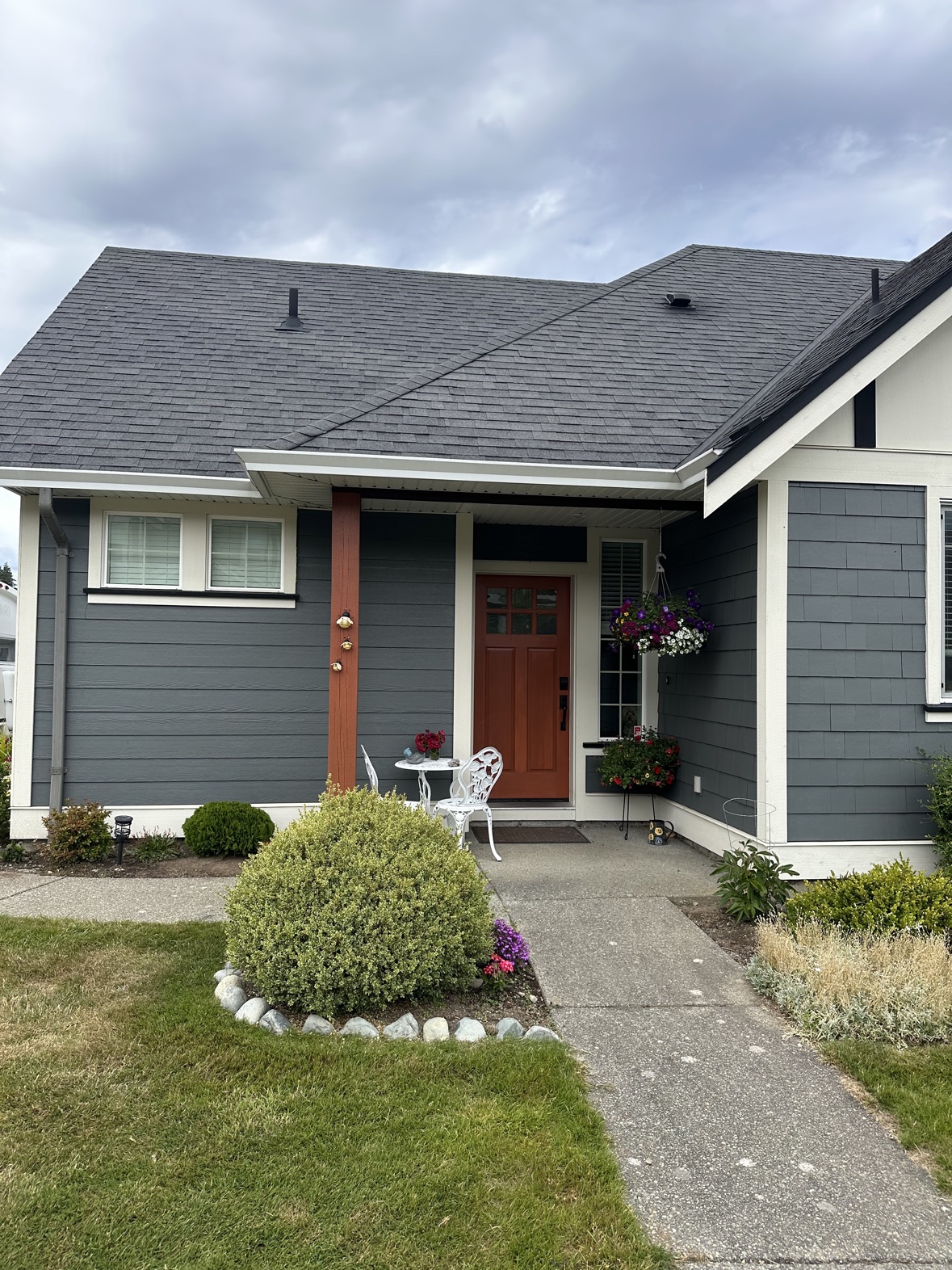 House exterior painting with a terracotta front door in Victoria, BC