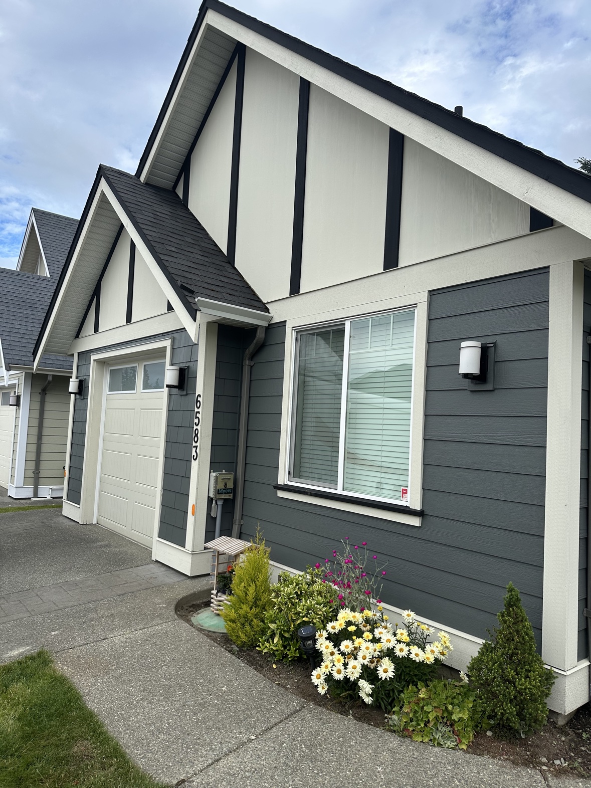 House exterior painting in gray-blue with white trim in Victoria, BC