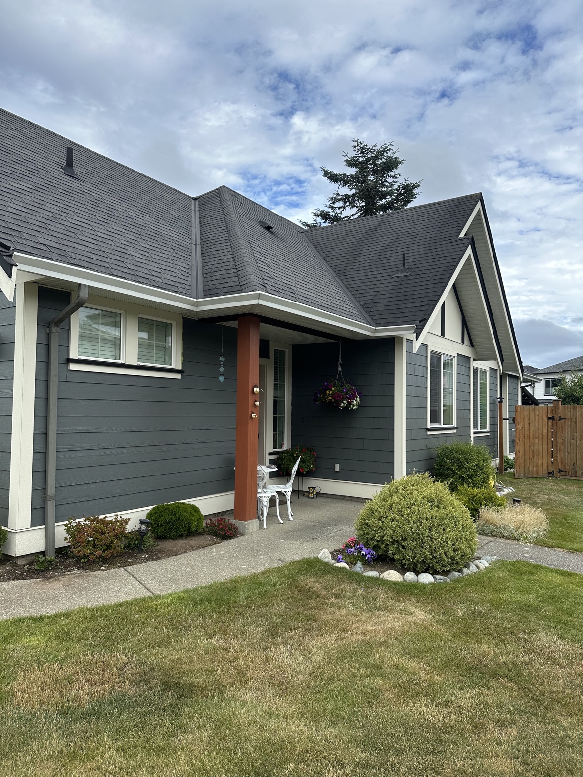 House exterior painting, gray-blue siding and porch in Victoria, BC