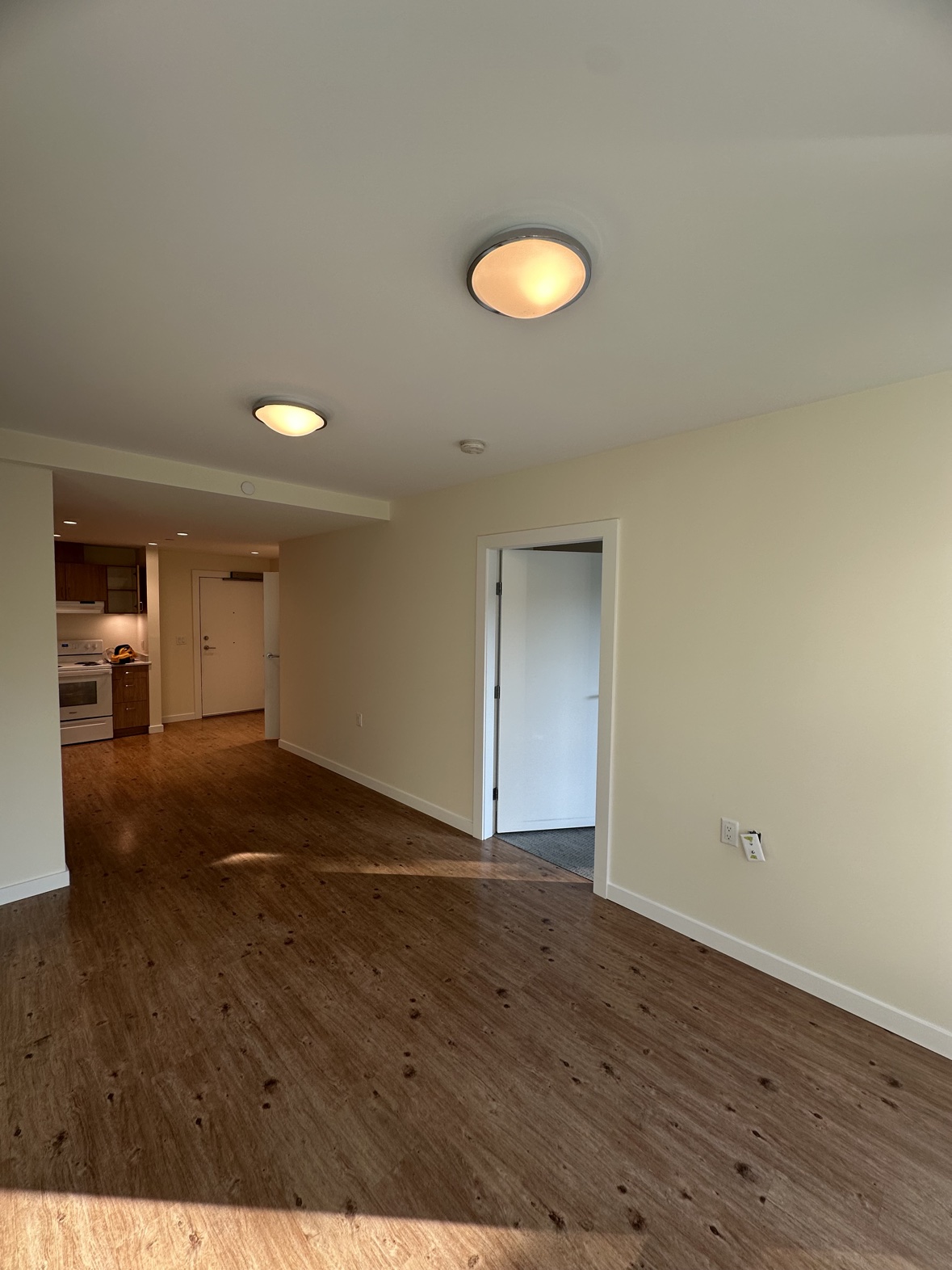 Interior repaint of a living room and kitchen in warm neutral tones in Victoria, BC