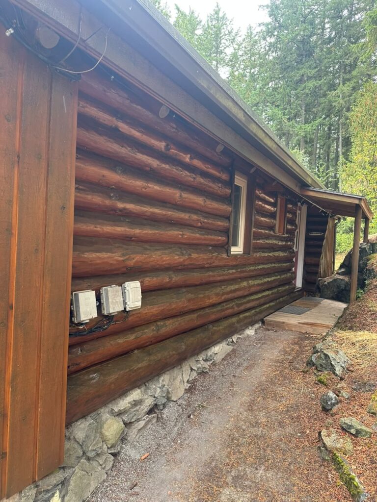 Log cabin exterior staining victoria bc by Rebirth Painting Ltd. in Victoria, BC