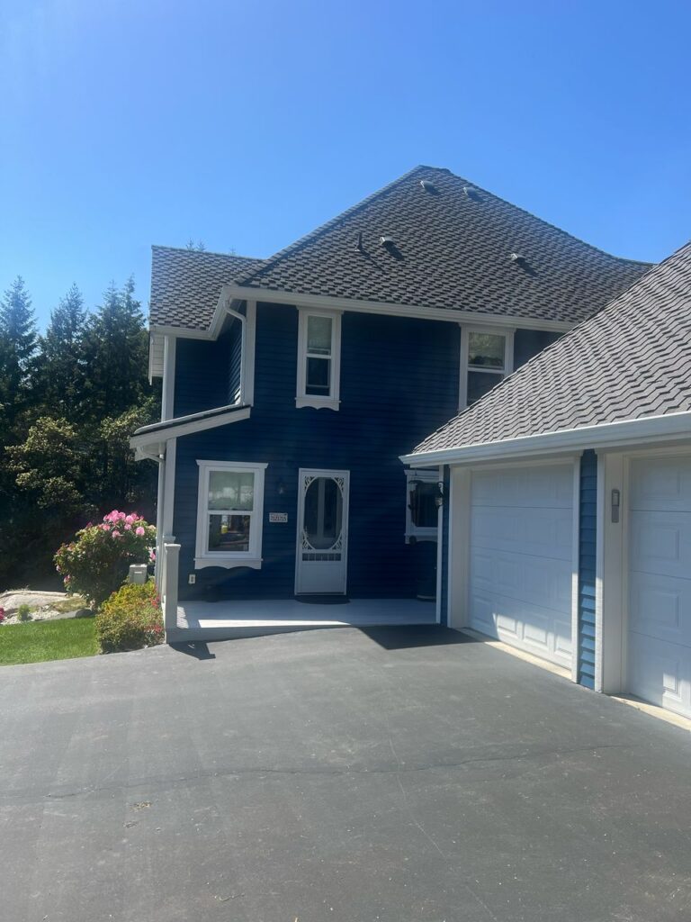 Navy house exterior painting white trim victoria by Rebirth Painting Ltd. in Victoria, BC