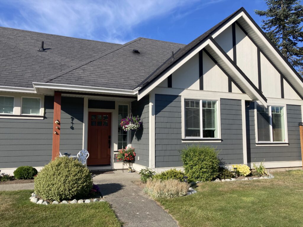 Teal house exterior painting garage victoria by Rebirth Painting Ltd. in Victoria, BC